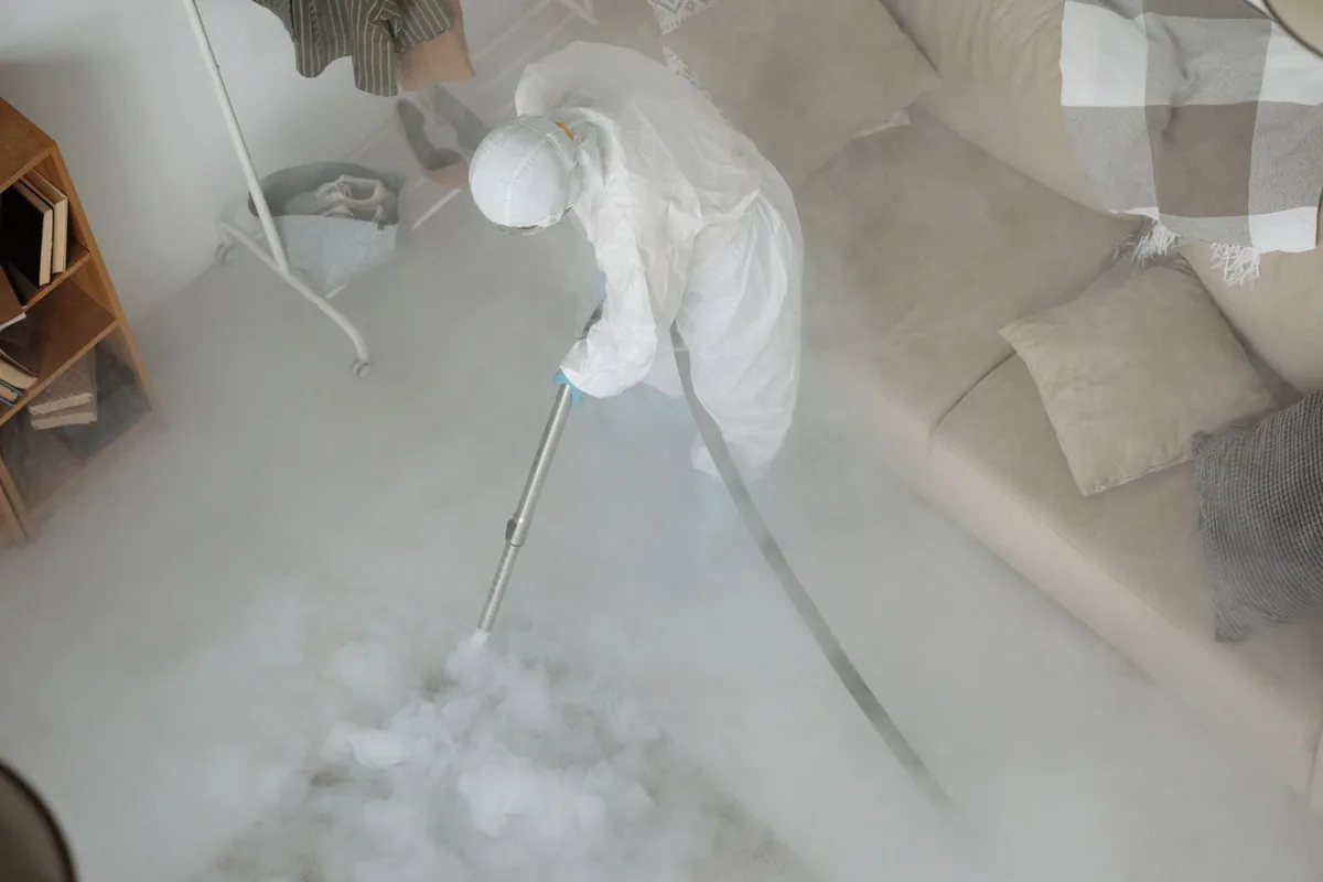 Biohazard cleanup technician in protective equipment, East Hills, NY